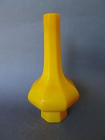 A marked beijing opaque yellow glass facetted bottle vase