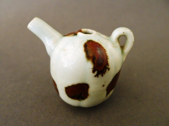 A perfect and rare Yuan Qingbai water dropper with iron brown spots