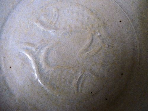 A Song-Yuan Qingbai glazed dish with molded twin fish decoration