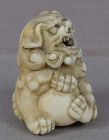 Early 19c Kyoto school netsuke SHISHI with ball