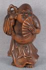 19c netsuke HOTEI with Buddhist rattle and fan