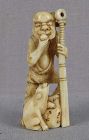 Early 19c marine netsuke ONI with club & PUPPY