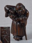 19c netsuke blind MASSEUR cleaning geta by ISSHO