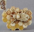 Netsuke marine BEE on honeycomb with grubs  by SERGEY CHERNIAVSKIY