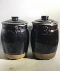 Pair of Chinese Qing Dynasty Black Glaze Lided Jars