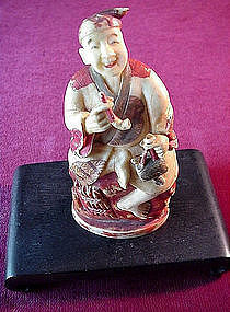 JAPANESE POLYCHROME IVORY OKIMONO {MAN wPIPE