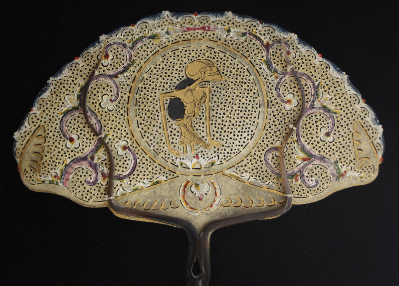 Traditional Indonesian ornate fan of hide and horn