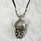 India woman's necklace with silver Lingam stone casket