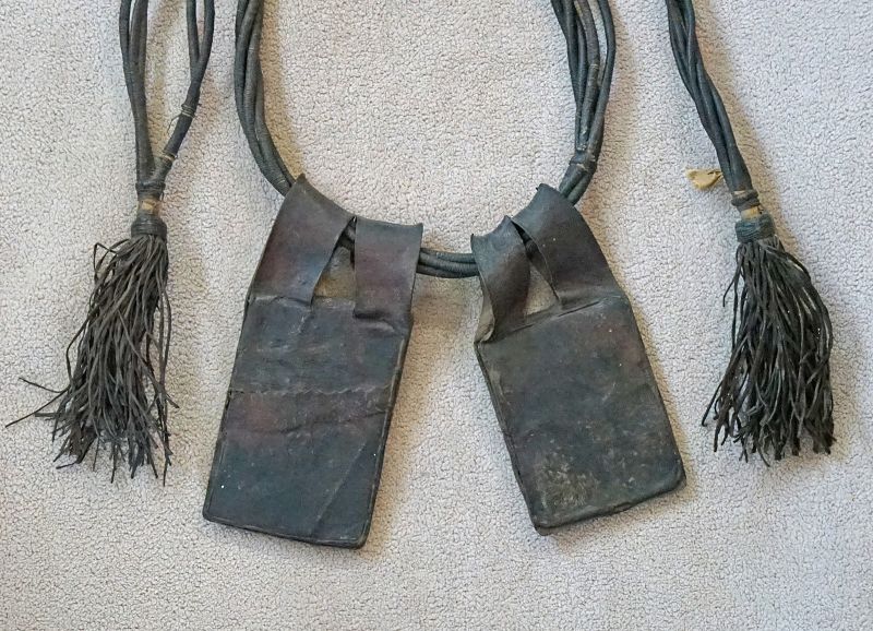 Antique African Tuareg leather belt with amulets