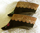 Pair Antique Chinese small embroidered lotus shoes