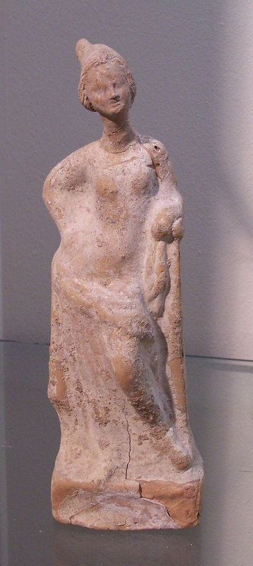 A LARGE GREEK TERRACOTTA STANDING FEMALE FIGURE
