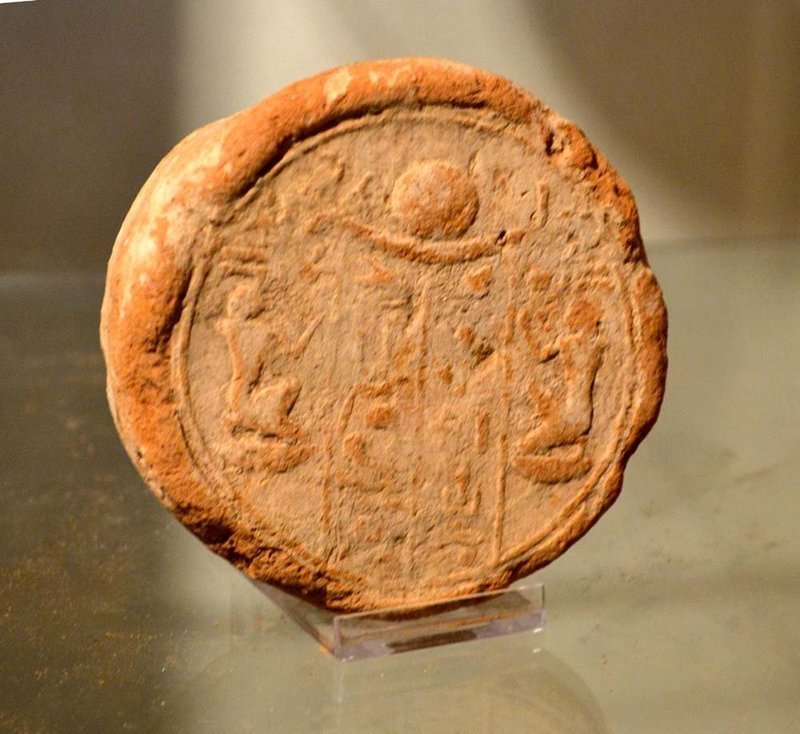 AN ANCIENT EGYPTIAN TERRACOTTA FUNERARY CONE