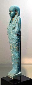 AN ANCIENT EGYPTIAN FAIENCE SHABTI FOR ANKH-EM-MAAT