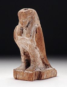 AN ANCIENT EGYPTIAN WOOD FIGURE OF A BA BIRD