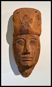 AN ANCIENT EGYPTIAN WOOD MASK FROM A SARCOPHAGUS