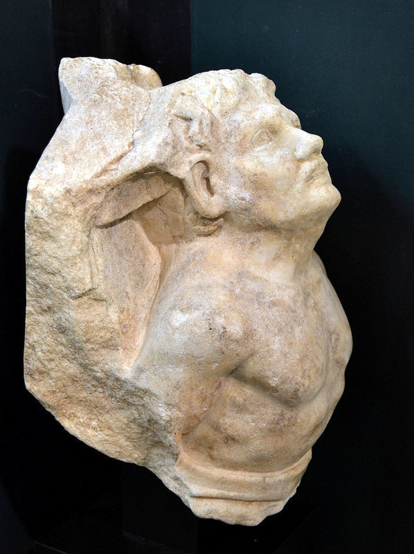 AN ANCIENT ROMAN MARBLE FIGURE OF A CAPTIVE