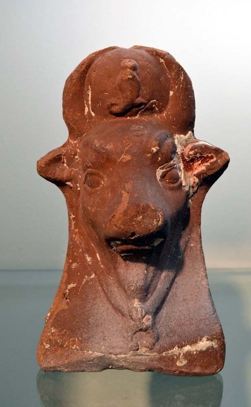 AN ANCIENT EGYPTIAN TERRACOTTA HEAD OF AN APIS-PUBLISHED