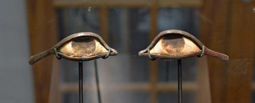 AN ANCIENT EGYPTIAN PAIR OF BRONZE EYES