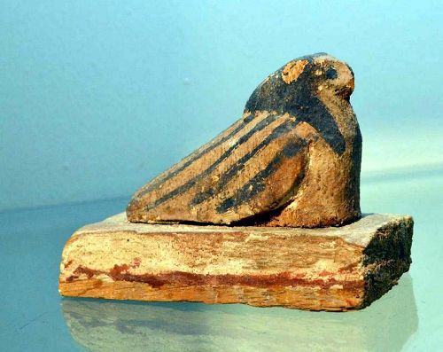 AN ANCIENT EGYPTIAN POLYCHROME WOOD FALCON
