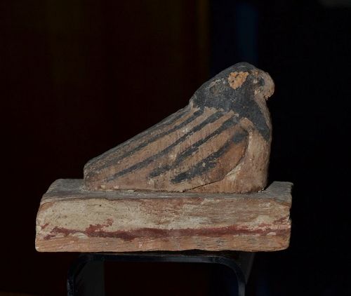 AN ANCIENT EGYPTIAN POLYCHROME WOOD FALCON