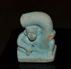 AN EGYPTIAN FAIENCE EROTIC FIGURE