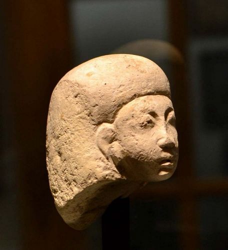 AN EGYPTIAN NEW KINGDOM LIMESTONE HEAD