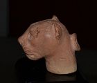 AN ANCIENT GREEK TERRACOTTA "PLASTIC" HEAD OF A FELINE