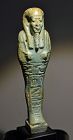 AN ANCIENT EGYPTIAN FAIENCE SHABTI FOR  HATHOR-EM-ACHET