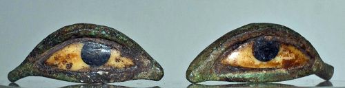 A PAIR OF ANCIENT EGYPTIAN BRONZE AND STONE EYES