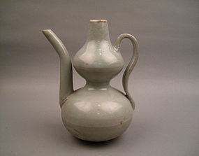 A Yuan Dynasty White Glaze Double Guard Ewer