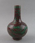 An Aubergine-Ground Green 'Dragon' Bottle Vase
