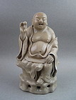 A Late Ming Dynasty Smiling Buddha Figure