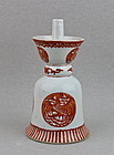 A CORAL-RED PHOENIX MEDALLIONS OIL LAMP