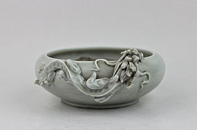 A PALE CELADON WASHER WITH A DRAGON RELIEF
