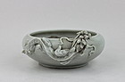 A PALE CELADON WASHER WITH A DRAGON RELIEF
