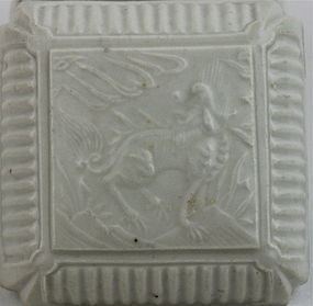 A MING DYNASTY WHITE GLAZE SQUARE SHAPED COVERED BOX WITH QIRIN