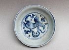 BLUE AND WHITE SAUCER DISH WITH LION PLAYING