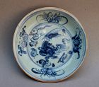 A MING DYNASTY BLUE AND WHITE DISH WITH QILIN