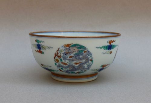 A RARE KANGXI DOUCAI BOWL WITH FOUR DRAGON MEDALLIONS