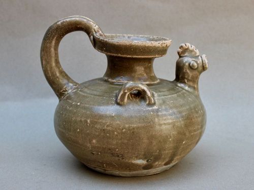 AN EARLY CELADON CHICKEN HEADED EWER