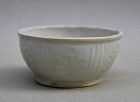 A MING DYNASTY WHITE GLAZED CUP WITH INCISED FLORAL SPRAYS