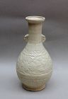 A YUAN DYNASTY FUJIAN YINGQING VASE WITH MOLDED FLOWER PATTERN