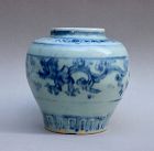 MING DYNASTY BLUE AND WHITE JAR WITH 'GUI' DRAGON HOLDING FLOWER