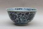 AN EARLY QING BLUE AND WHITE BOWL WITH FLORAL SCROLL