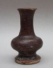 AN EARLY BLACK GLAZED SMALL VASE