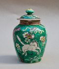 A FINE POLYCHROME JAR & COVER WITH HORSES