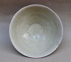 A SONG DYNASTY WITH INCISED FISH CONICAL BOWL