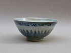 A MING DYNASTY BLUE AND WHITE BOWL WITH LOTUS PETALS