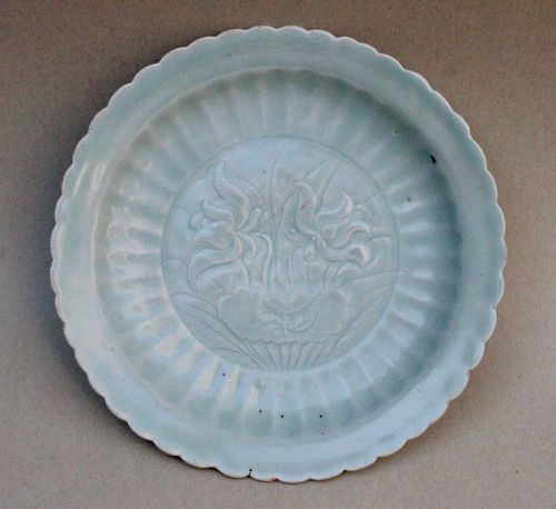 A RARE YUAN DYNASTY JINDEZHEN QINGBAI DISH WITH INCISED LOTUS