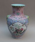 A FINE QING DYNASTY FAMILLE ROSE VASE WITH ELEPHANT MASK